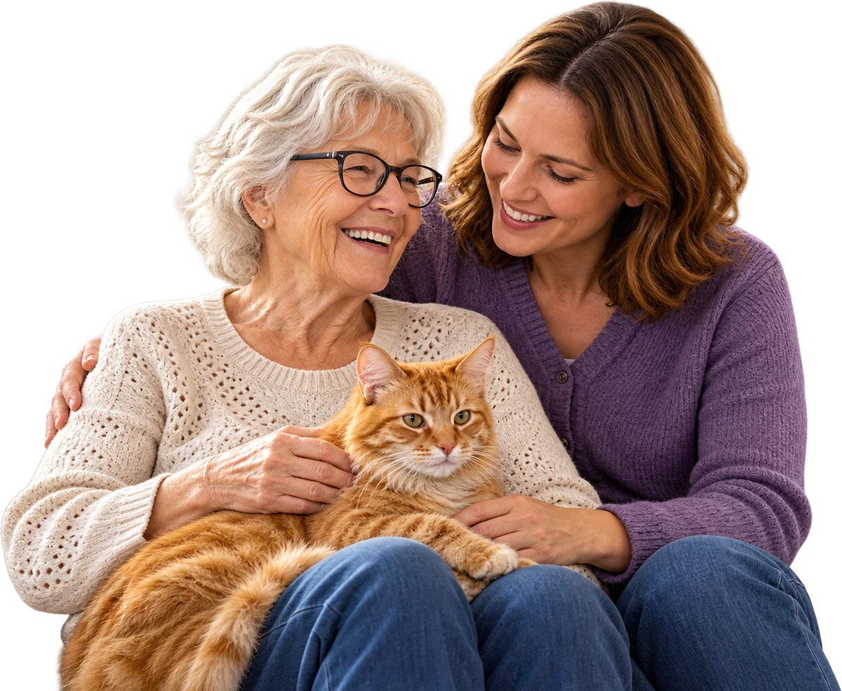 Eine ältere Dame mit ihrer roten Katze auf dem Schoss lacht mit ihrer Tochter